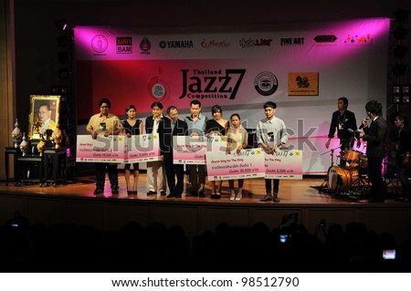 BANGKOK - MARCH 7: Winning finalists collect awards on stage at the Bangkok Art and Culture Centre during the 7th annual Thailand Jazz Competition on March 7, 2012 in Bangkok, Thailand.