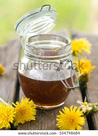 Flower honey in glass jar, selective focus