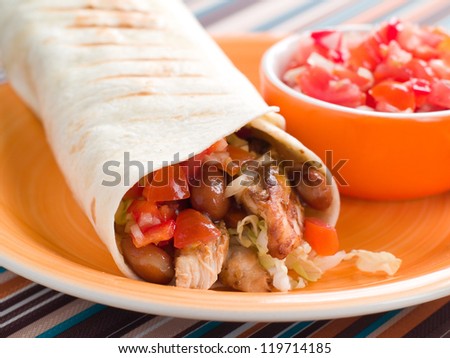 Wrap with grilled chicken, bean and tomato salsa, selective focus