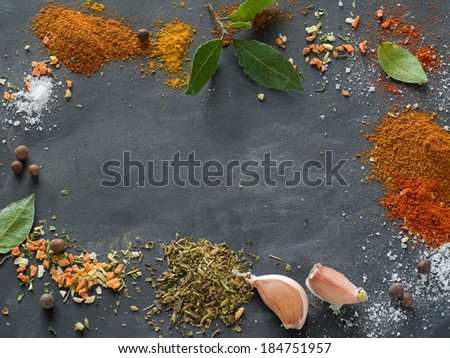 Assorted spices on blackboard background, selective focus