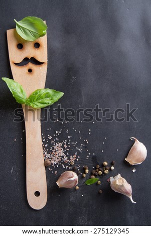 Vintage chalk board with spatula and spice, selective focus.  Cooking concept