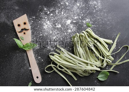 Fresh homemade pasta  with spatula on table, selective focus