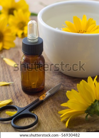 Massage oil for nail and manicure scissors. Lilac on background. Could be a generic toiletry.