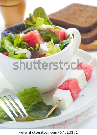 Salad from lettuce, watermelon and feta in cup