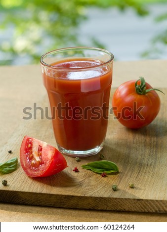 Freshly squeezed tomato juice in glass