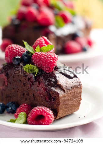 Beautiful chocolate cake with fresh berry. Selective focus - stock photo