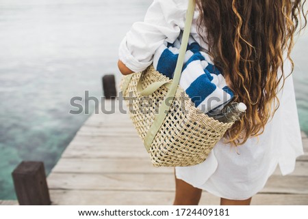 Similar – Image, Stock Photo Unrecognizable traveler on beach on cloudy day