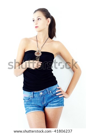fashion girl wearing simple clothes standing near the wall