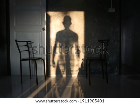 Image, Stock Photo Murderer, standing in black letters, as lettering, on an old squat house, with many windows, behind a brick wall painted with graffiti. Sign as an appeal against racism, war, hatred, violence, brutality and discrimination.