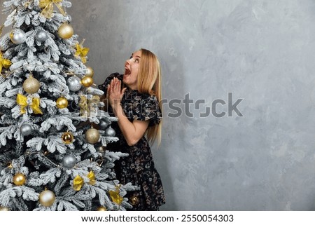 Similar – Image, Stock Photo Beautiful woman decorating hair with copper wreath against plank wall