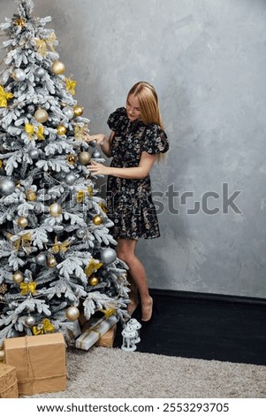 Similar – Image, Stock Photo Beautiful woman decorating hair with copper wreath against plank wall