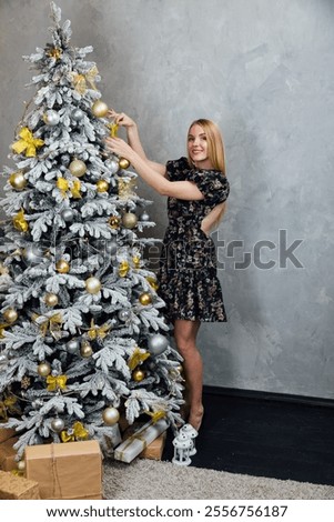 Image, Stock Photo Beautiful woman decorating hair with copper wreath against plank wall