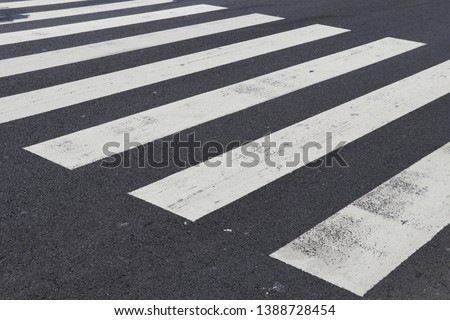 Similar – Foto Bild auf dem Zebrastreifen auf der Straße gehen.