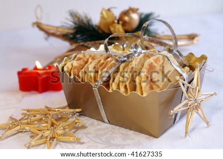 Homemade waffles for Christmas and New Year gift in a golden box, arranged with festive decoration
