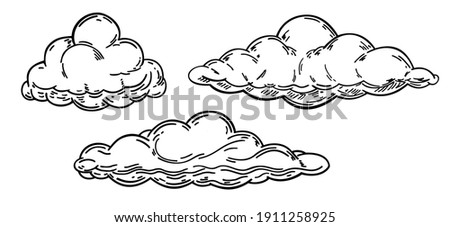 Hand drawn clouds set. Clouds of various shapes in retro engraving style. Set of clouds in sketch style isolated on white background. Cartoon design elements. Vector vintage illustration. 