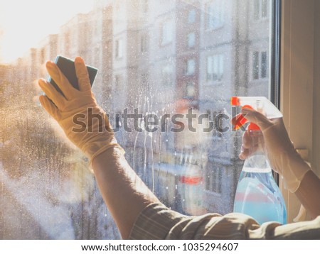 Similar – Image, Stock Photo Man washing window in yellow rubber gloves