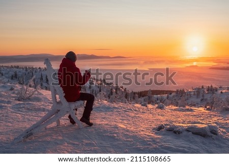 Similar – Image, Stock Photo Traveler contemplating snowy ridge in sunlight