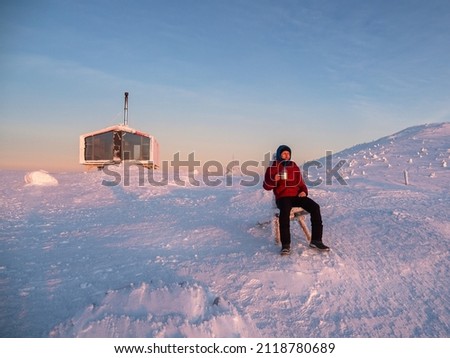 Similar – Image, Stock Photo Traveler contemplating snowy ridge in sunlight
