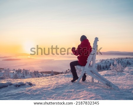 Similar – Image, Stock Photo Traveler contemplating snowy ridge in sunlight