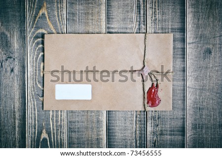 Vintage postal envelope on wood texture