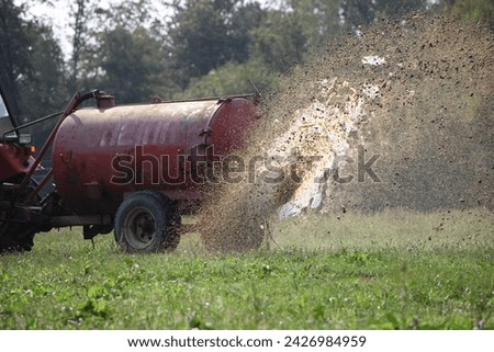 Similar – Foto Bild Traktor, der Kuhdung von oben besprüht #2