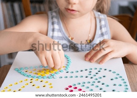 Similar – Image, Stock Photo Girl playing with mosaic board game