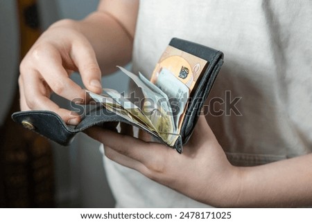 Similar – Image, Stock Photo Hands take out Euro from wallet