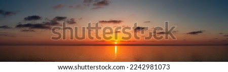 Similar – Image, Stock Photo Scenic sunset over sea and snowy mountains