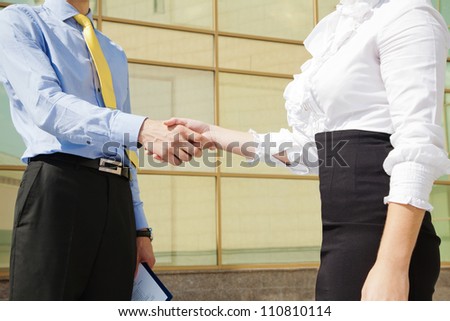 Close-up of business handshake: partners making agreement