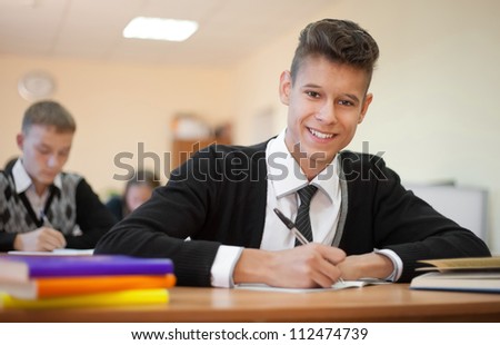 Young happy student looking at the camera during examination