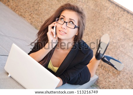 Image of a businesswoman lying on the floor