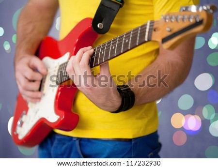musicians hands  playing song on guitar