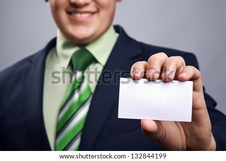 Close-up of businessman gives presenting card
