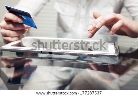 Woman holding tablet pc and credit card indoor, Shopping Online