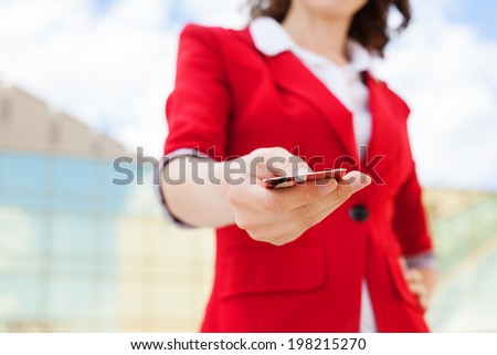 Close-up of business woman holding credit card