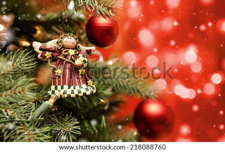 Toy angel hanging on the Christmas tree
