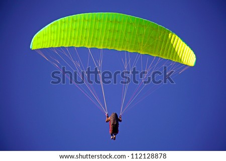 CRIMEA, UKRAINE - SEPTEMBER 4: Competitor of hang gliding competitions takes part in the Klementieva mountain on September 4, 2012 in Crimea, Ukraine