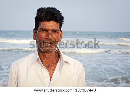 Pondicherry, SOUTH INDIA - JAN 18: Indian fisherman after fishing, his main work, during local Pongal Festival on January 18, 2013 in Pondicherry, Tamil Nadu, South India