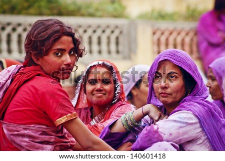JAIPUR, INDIA - MARCH 17: People covered in paint on Holi festival, March 17, 2013, Jaipur, India. Holi, the festival of colors, marks the arrival of spring, one of the biggest festivals in India