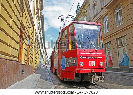LVIV, UKRAINE - JUNE 29: Old streetcar goes along the  streets on June 29, 2013 in Old Town of Lviv, Ukraine. Population of Lviv is over 830.000 people. Since 1998 is the UNESCO World Heritage.