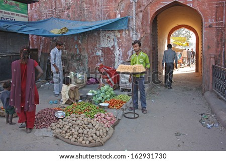 JAIPUR, INDIA - NOVEMBER 20: Unidentified vendors sell vegetables in the market on November 20, 2012 in Jaipur, India. Agricultural sector makes up 18.1% of GDP. India is a big producer for vegetables