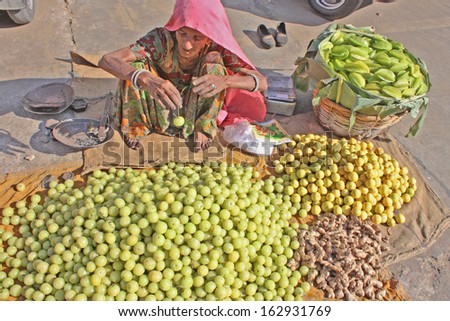 JAIPUR, INDIA - NOVEMBER 20: Unidentified vendors sell vegetables in the market on November 20, 2012 in Jaipur, India. Agricultural sector makes up 18.1% of GDP. India is a big producer for vegetables