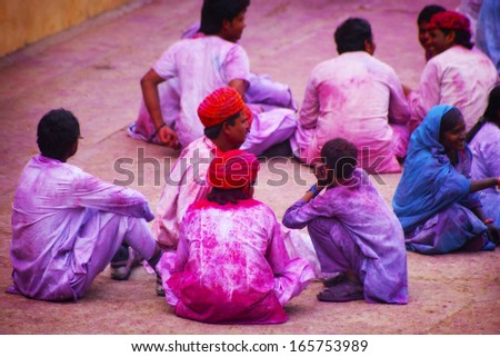 JAIPUR, INDIA - MARCH 17: People covered in paint on Holi festival, March 17, 2013, Jaipur, India. Holi, the festival of colors, marks the arrival of spring,one of the biggest festivals in India