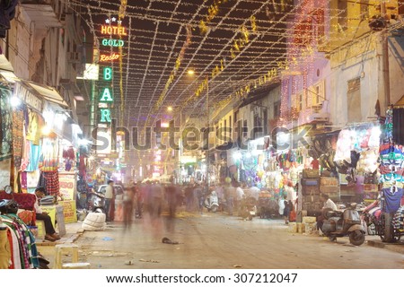 DELHI, INDIA - NOVEMBER 2: People are busy with daily activities on famous Main Bazaar Road on November 2, 2013 in Delhi