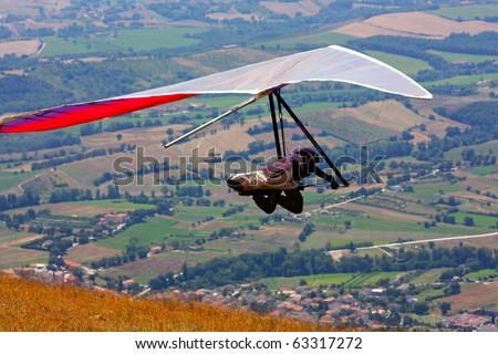 MONTE CUCCO, ITALY - AUGUST 12: Competitor of the Dutch Open-2010 hang gliding competitions taking part on the Monte Cucco mountain on August 12, 2010 near Cigillo, Italy.