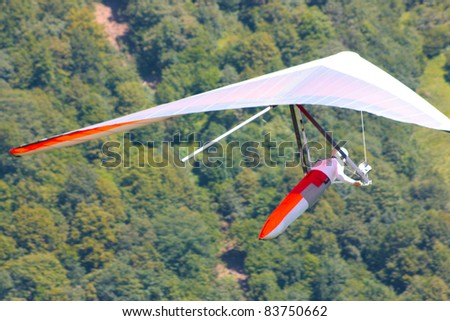TOLMIN, SLOVENIA - AUGUST 20: Competitor  takes part in the Kobala Open-2011 hang gliding competitions on August 20, 2011 near Tolmin, Slovenia.