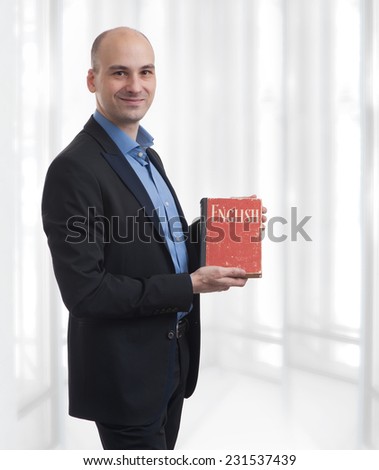Learning english concept. Man with book portrait