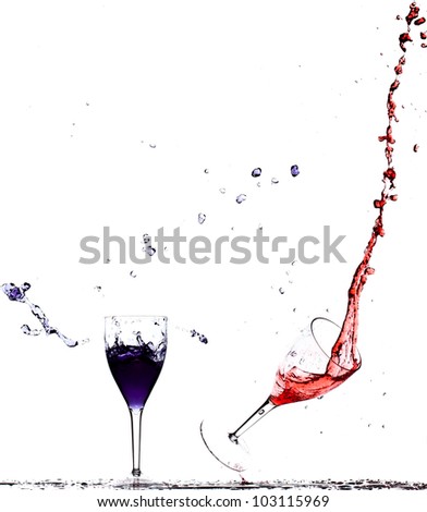 wine glasses falling with blue and red liquid