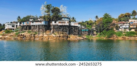 Similar – Foto Bild Haus auf Stelzen am See in der Nähe der Berge