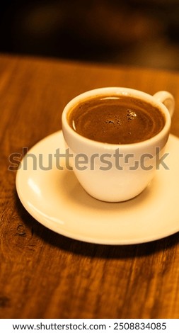 Similar – Image, Stock Photo Turkish espresso pot made of hammered metal stands for coffee preparation on the gas flame of the kitchen stove